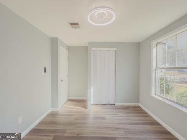 unfurnished bedroom with light wood-type flooring