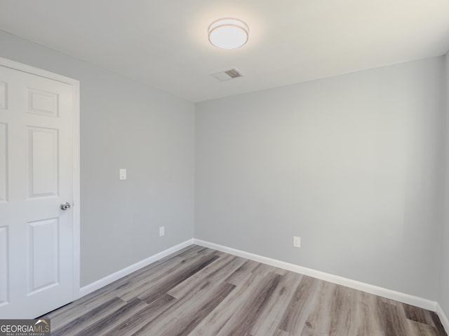 unfurnished room featuring light wood-type flooring