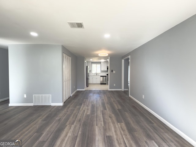 spare room with dark hardwood / wood-style flooring