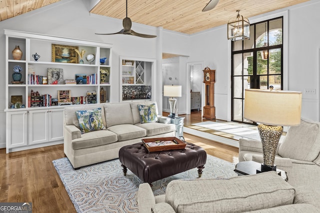 living room featuring light hardwood / wood-style flooring, wooden ceiling, and ceiling fan with notable chandelier