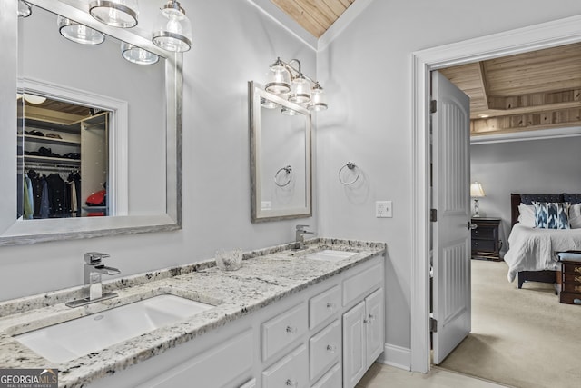 bathroom with vanity, vaulted ceiling, and wooden ceiling