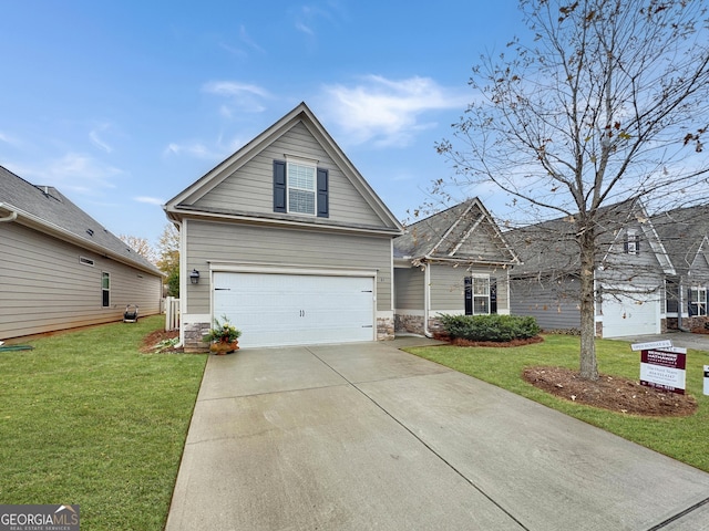 view of front of property with a front yard and a garage