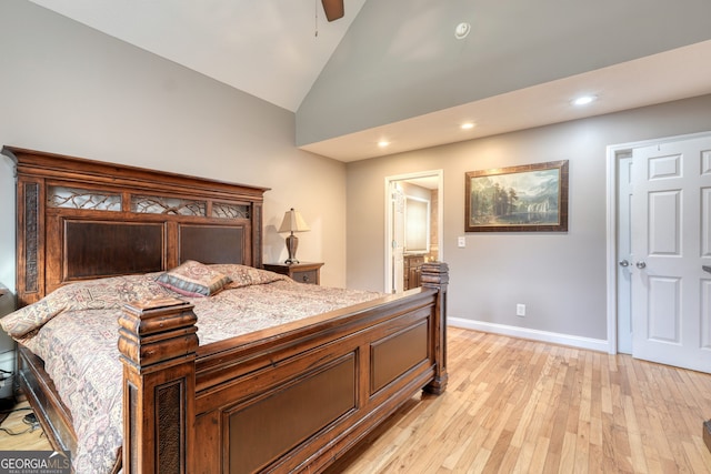 bedroom with light hardwood / wood-style floors, ceiling fan, and vaulted ceiling