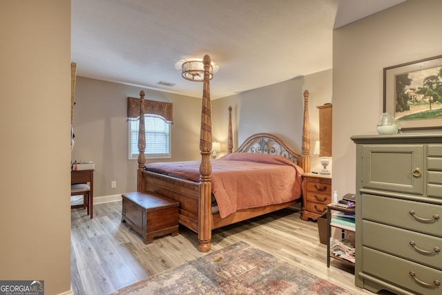 bedroom with light hardwood / wood-style flooring