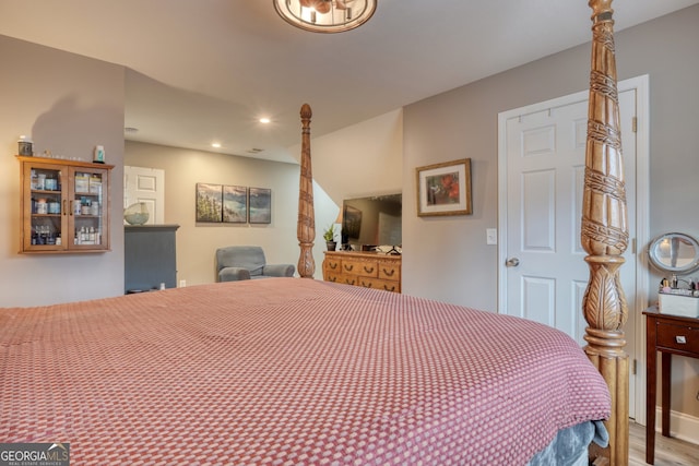 bedroom with wood-type flooring