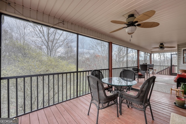 sunroom / solarium with ceiling fan and plenty of natural light