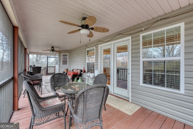 sunroom / solarium with ceiling fan