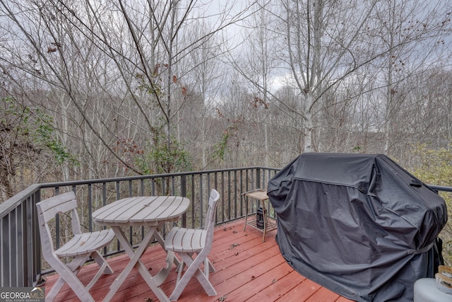 wooden deck featuring grilling area