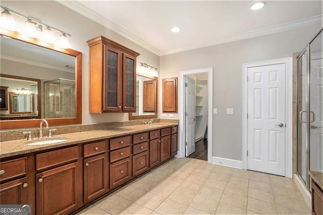 bathroom with vanity, tile patterned floors, walk in shower, and ornamental molding