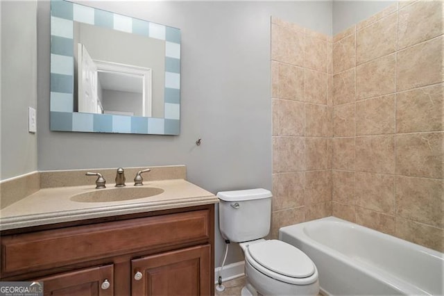 full bathroom featuring vanity, toilet, and tiled shower / bath