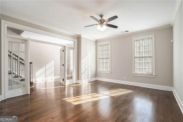 unfurnished room with crown molding, dark hardwood / wood-style floors, and ceiling fan