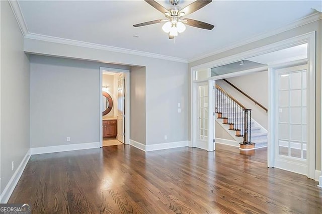 unfurnished room featuring ceiling fan, dark hardwood / wood-style flooring, ornamental molding, and french doors