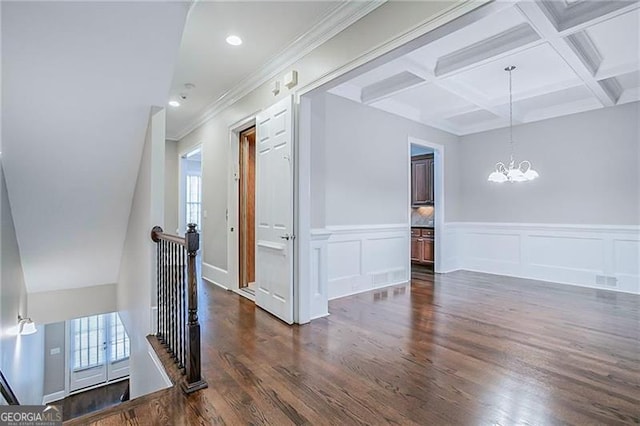 hall featuring beam ceiling, dark hardwood / wood-style floors, a wealth of natural light, and crown molding