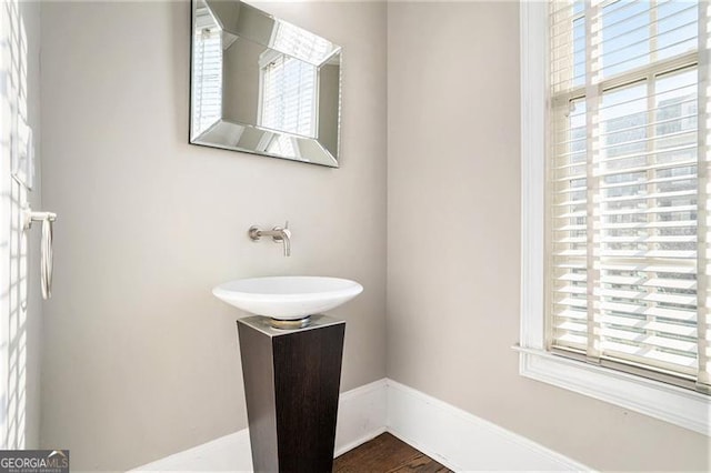 bathroom with vanity and wood-type flooring