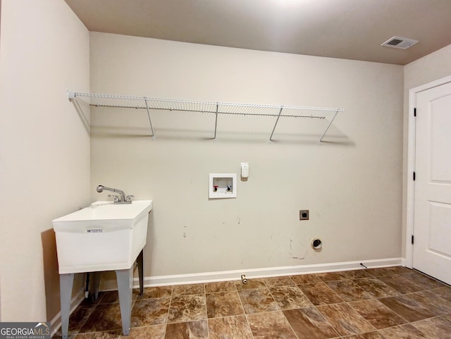 laundry room with hookup for a washing machine and hookup for an electric dryer