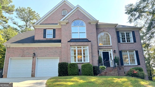 view of front facade with a front lawn and a garage