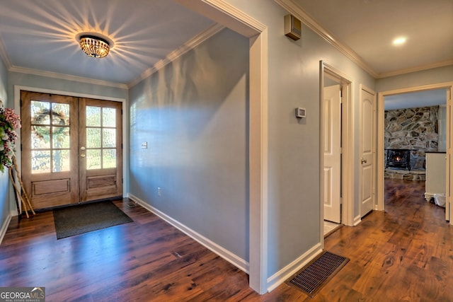 foyer featuring crown molding, french doors, and dark hardwood / wood-style floors