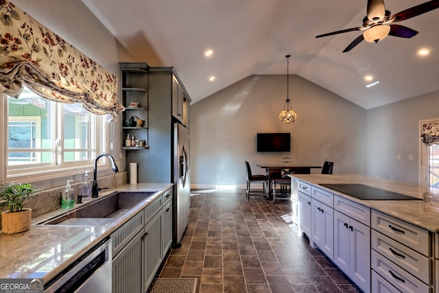 kitchen with lofted ceiling, hanging light fixtures, sink, gray cabinets, and appliances with stainless steel finishes