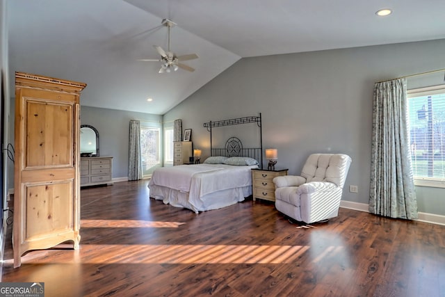 bedroom with ceiling fan, dark hardwood / wood-style flooring, and vaulted ceiling