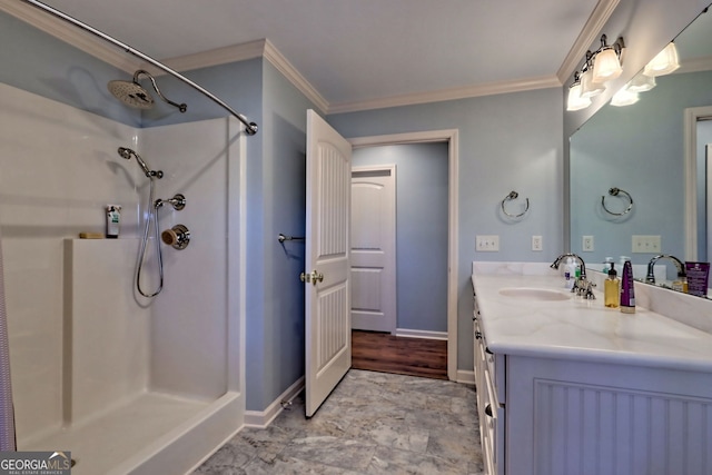 bathroom featuring walk in shower, vanity, and ornamental molding