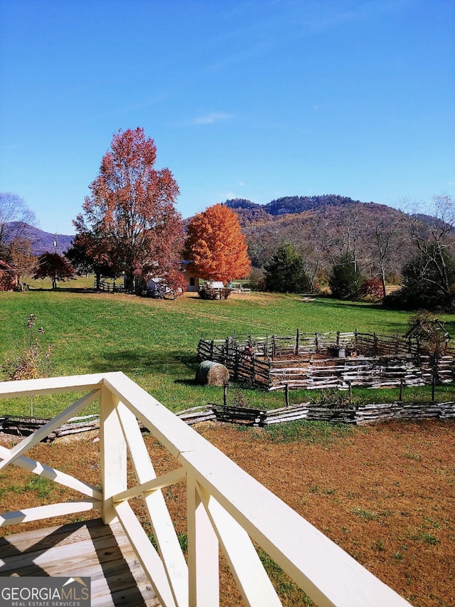 mountain view featuring a rural view