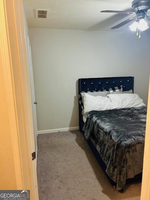 bedroom featuring carpet and ceiling fan