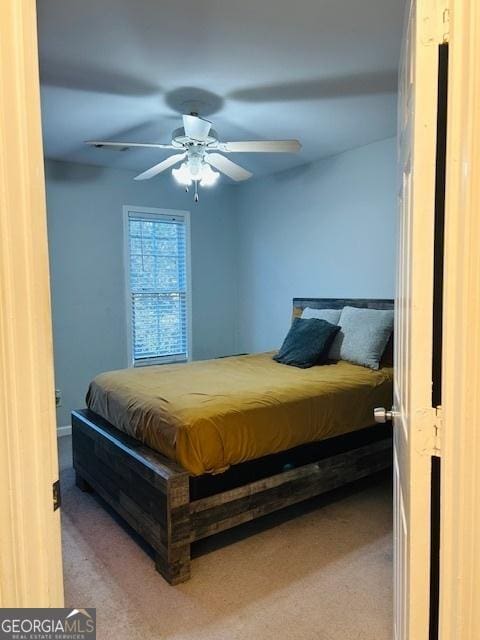 carpeted bedroom featuring ceiling fan