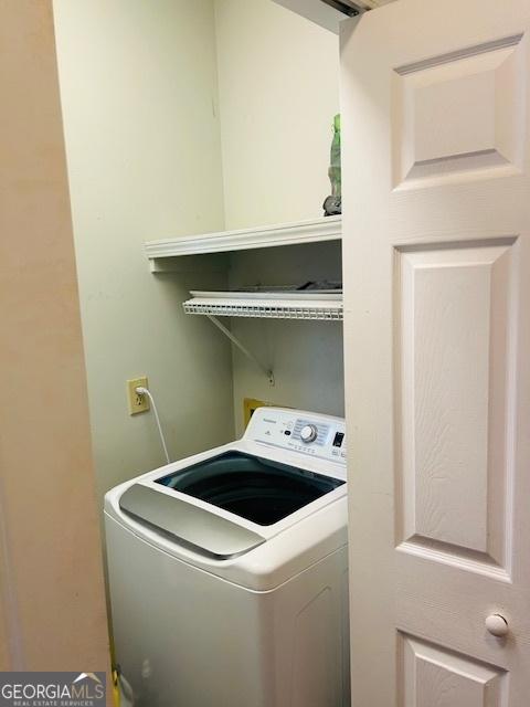 laundry area with washer / dryer