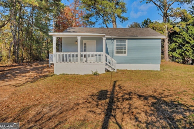 bungalow-style house with a front lawn and a porch