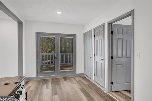 doorway to outside featuring light hardwood / wood-style floors