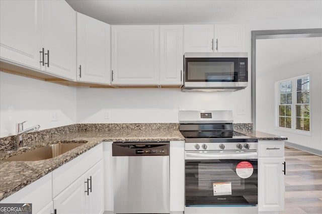 kitchen with white cabinets, sink, and stainless steel appliances