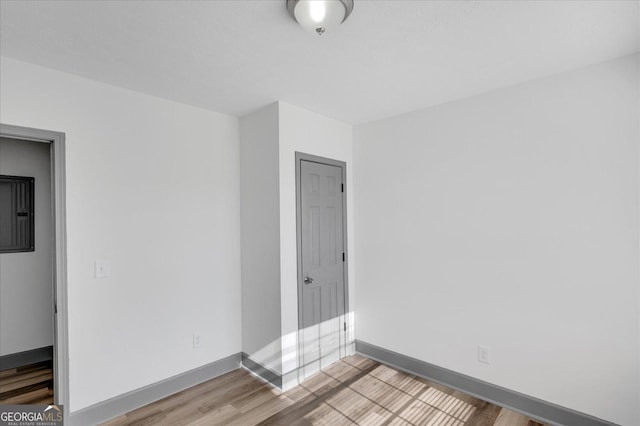 spare room featuring light hardwood / wood-style flooring