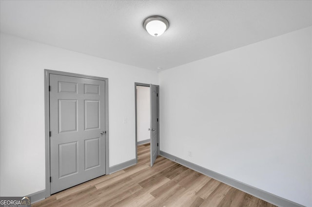 unfurnished bedroom featuring light hardwood / wood-style floors