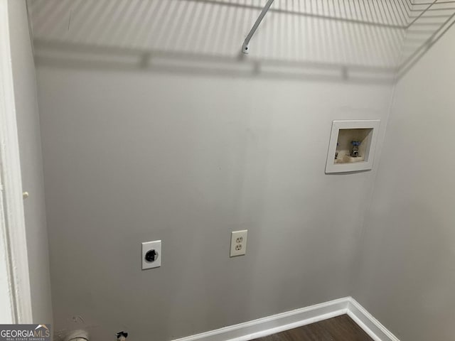 laundry room with gas dryer hookup, hardwood / wood-style floors, washer hookup, and hookup for an electric dryer