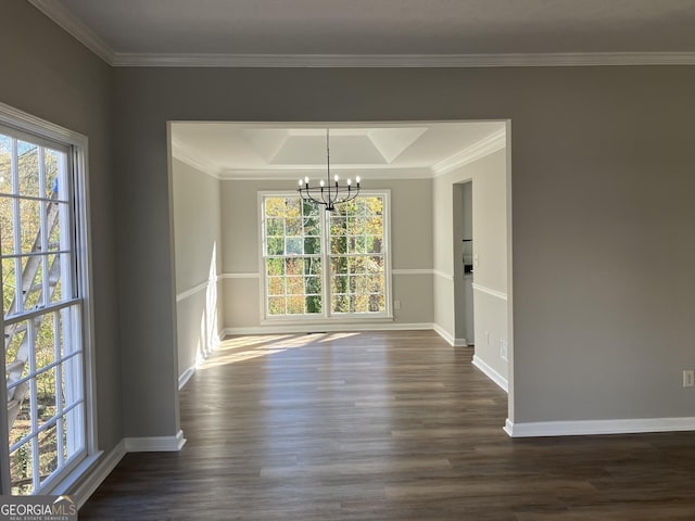 unfurnished dining area featuring plenty of natural light, dark hardwood / wood-style floors, and a chandelier