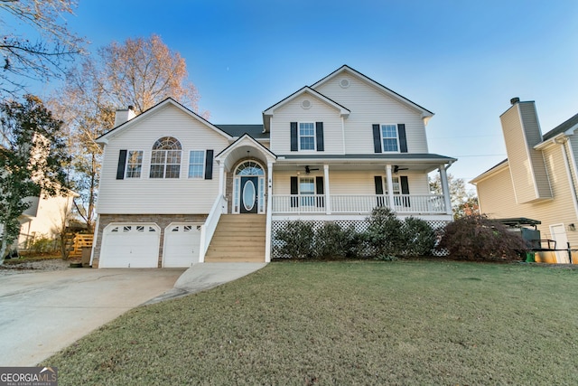 view of front facade with a front lawn, a porch, and a garage