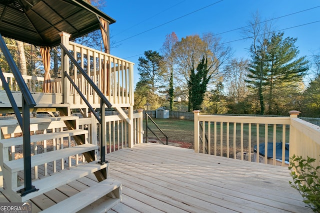 wooden deck with a shed