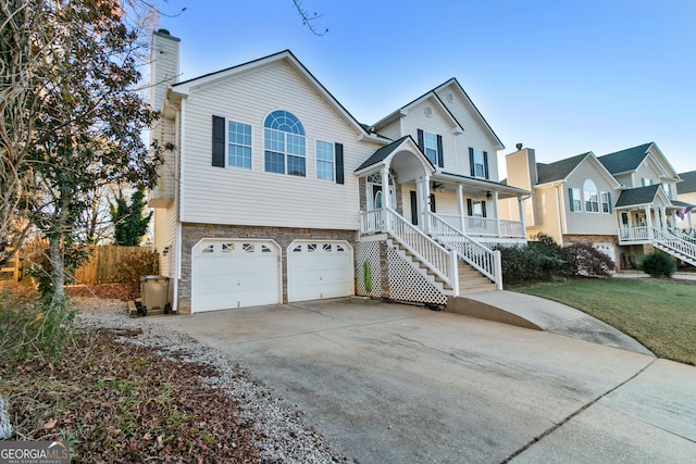 view of front of house featuring a porch and a garage