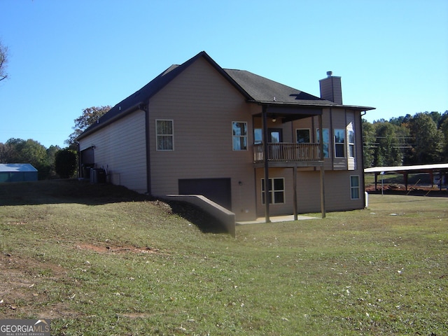 rear view of property featuring cooling unit and a lawn