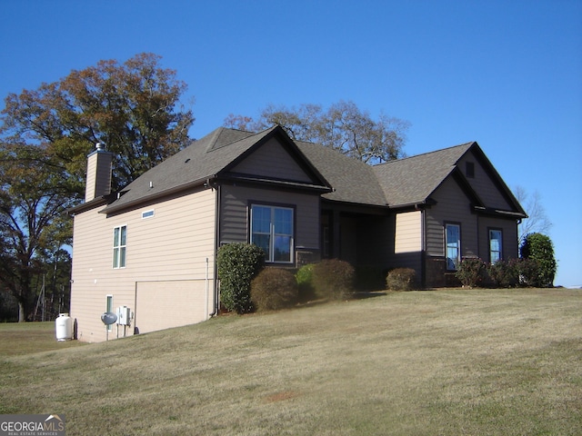 view of property exterior with a lawn