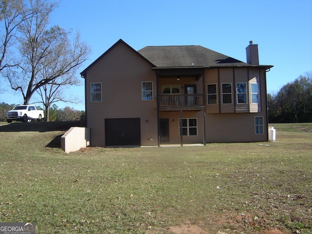 rear view of house with a lawn