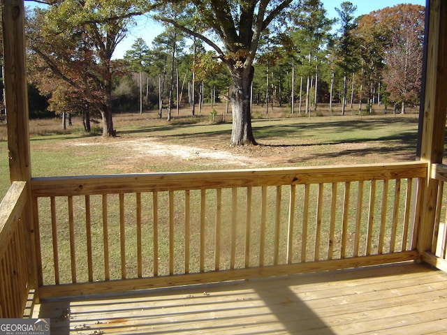 wooden deck with a yard