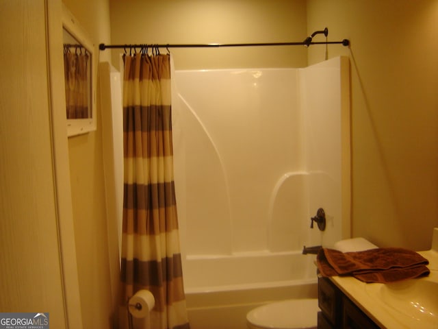 full bathroom with shower / tub combo, vanity, and toilet