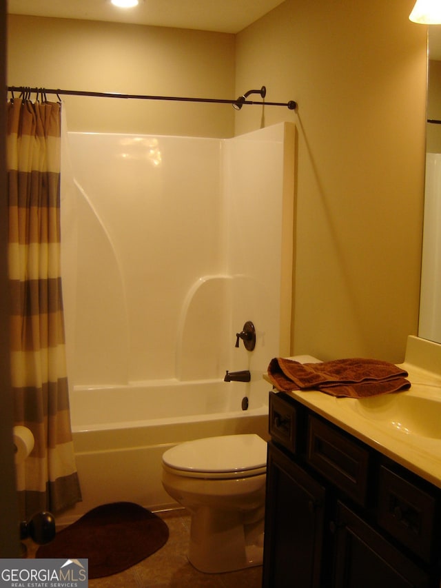 full bathroom featuring tile patterned floors, vanity, toilet, and shower / tub combo with curtain