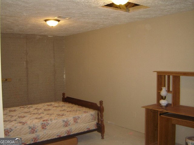 bedroom featuring a textured ceiling