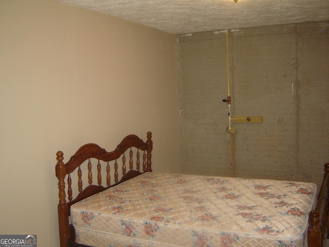 bedroom featuring a textured ceiling