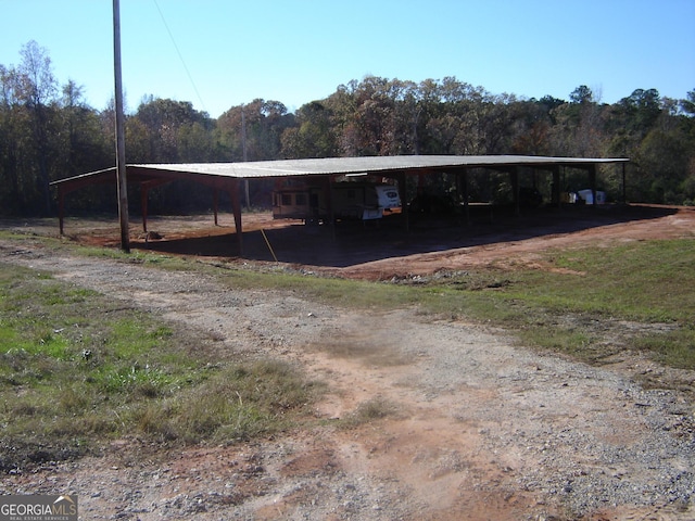 view of vehicle parking featuring a carport