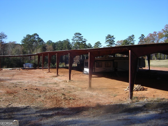 view of parking with a carport