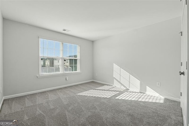 view of carpeted spare room