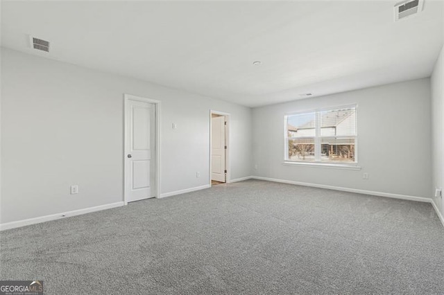 unfurnished room featuring carpet